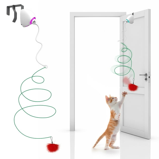 a cute cat playing with a cat rope toy attached to a door