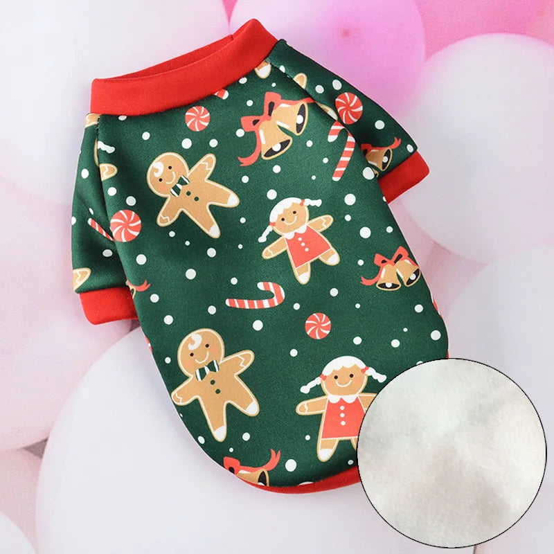 a cute green cat pajama costume cotton and comfy with white snow dots and ginger bread cookies and bells Christmas theme