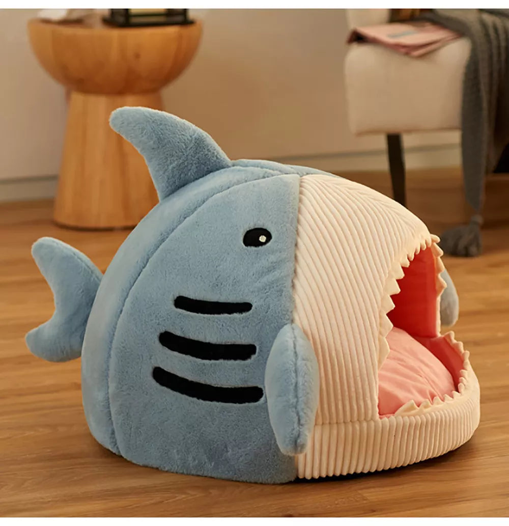 a cute cat bed that looks like a shark with his mouth open