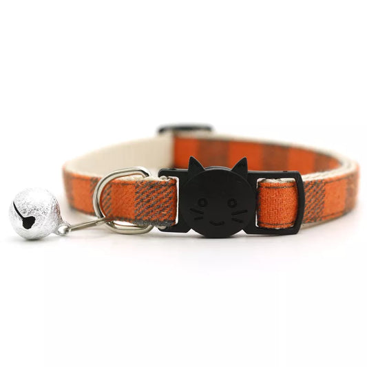 cute orange cat collar with a bell and a smiley cat face shape 