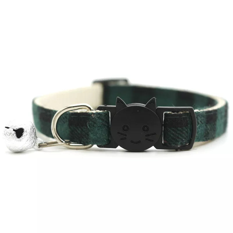 cute green and black cat collar with a bell and a smiley cat face shape 