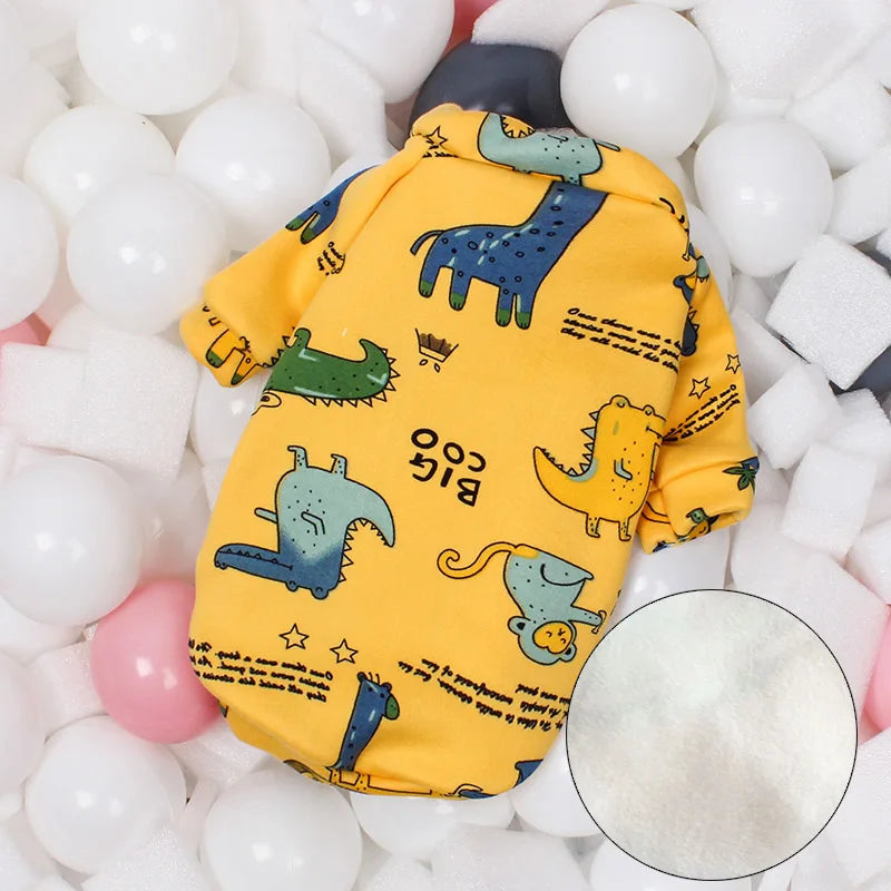 a cute yellow cat pajama costume comfy and cotton with cute blue yellow and green Dinosaurs  on it