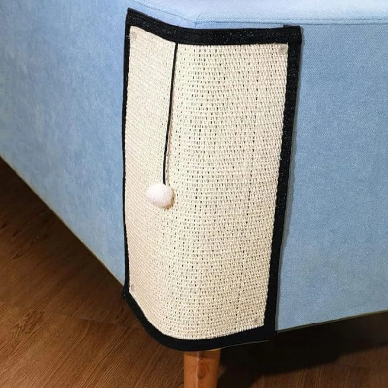 a beige cat scratching pad on the corner of a piece of furniture 