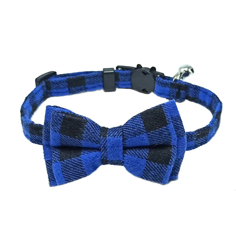a cute blue and black cat bowtie collar with a bell