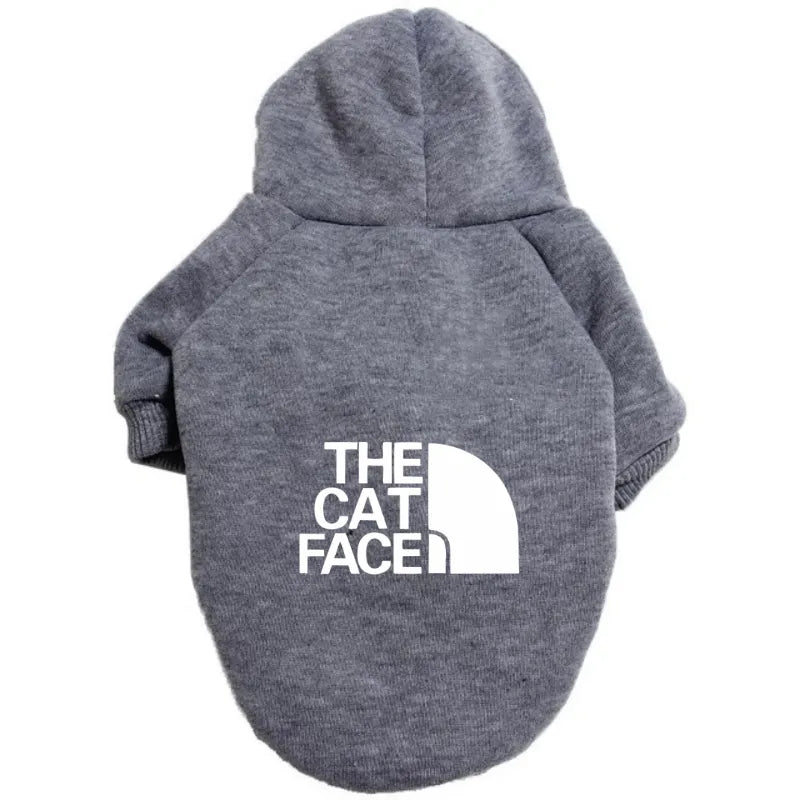 a cute gray cat hoodie outfit costume that says "the cat face" on the back