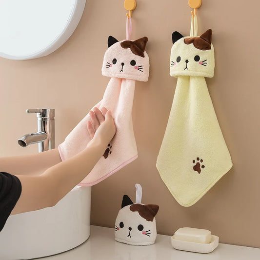 hand drying on a pink and yellow very soft cotton cat shaped towels 