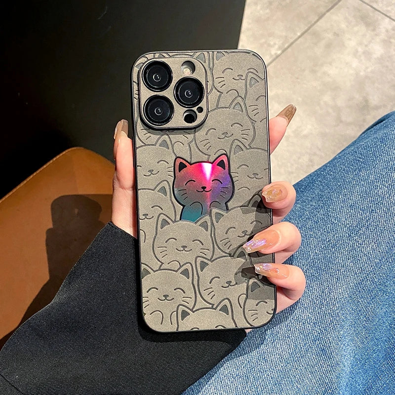 a hand holding a super cute gray cat I phone case with a colorful cat in the back