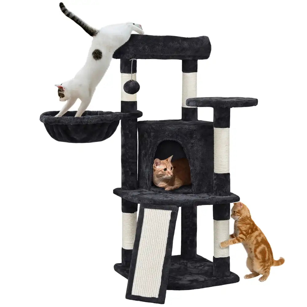 a black cat tree castle house with 3 cats cute cats playing and scratching on it in a cozy room