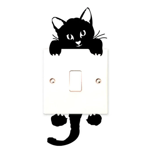 light switch with a black cat sticker that looks like its hanging on it 
