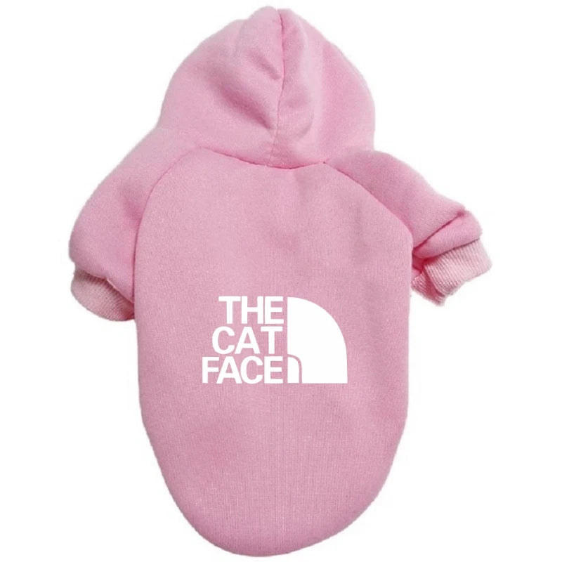 a cute pink cat hoodie outfit costume that says "the cat face" on the back