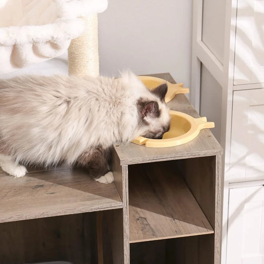 a cute cat eating from a bowl in a wooden cabinet