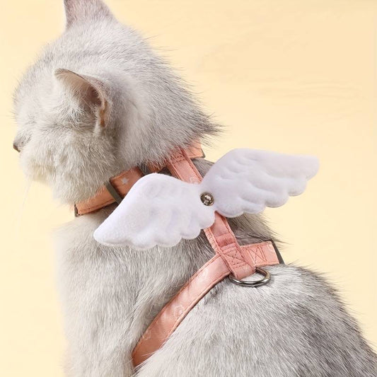 cute cat wearing a pink leash harness with white angel wings 