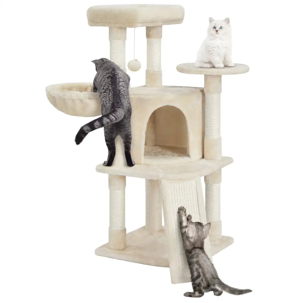 a white cat tree castle house with 3 cats cute cats playing and scratching on it in a cozy room