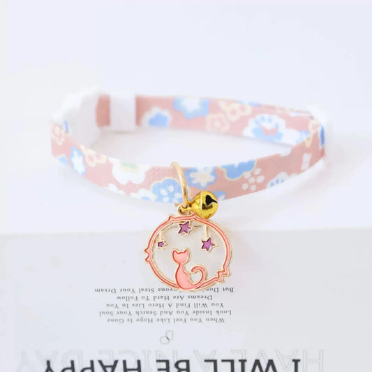 cute pink cat collar with flowers with bell and a fixture of a cat looking at stars